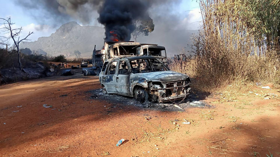 This handout image from the Karenni Nationalities Defense Force (KNDF) taken and released on December 25, 2021 shows burnt vehicles in Hpruso township in Kayah state. -----EDITORS NOTE --- RESTRICTED TO EDITORIAL USE - MANDATORY CREDIT 