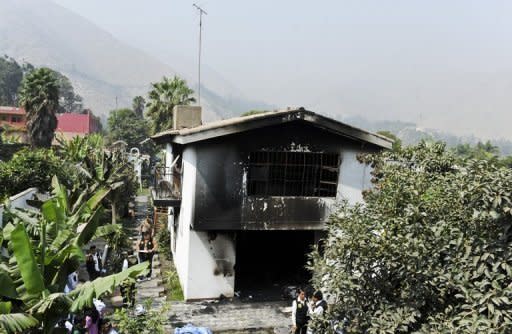 The burnt building of the "Sagrado Corazon de Jesus" rehabilitation centre for drug and alcohol addicts, in Chosica district, in Lima is pictured. Fire swept through the drug rehabilitation center early Saturday, killing 14 people who were unable to escape the inferno because windows were barred and doors were locked, firefighters said