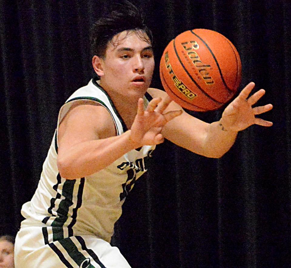 Clark-Willow Lake's Kaplan Felberg dishes the ball during a Northeast Conference high school basketball doubleheader on Thursday, Jan. 19, 2023 in Clark.