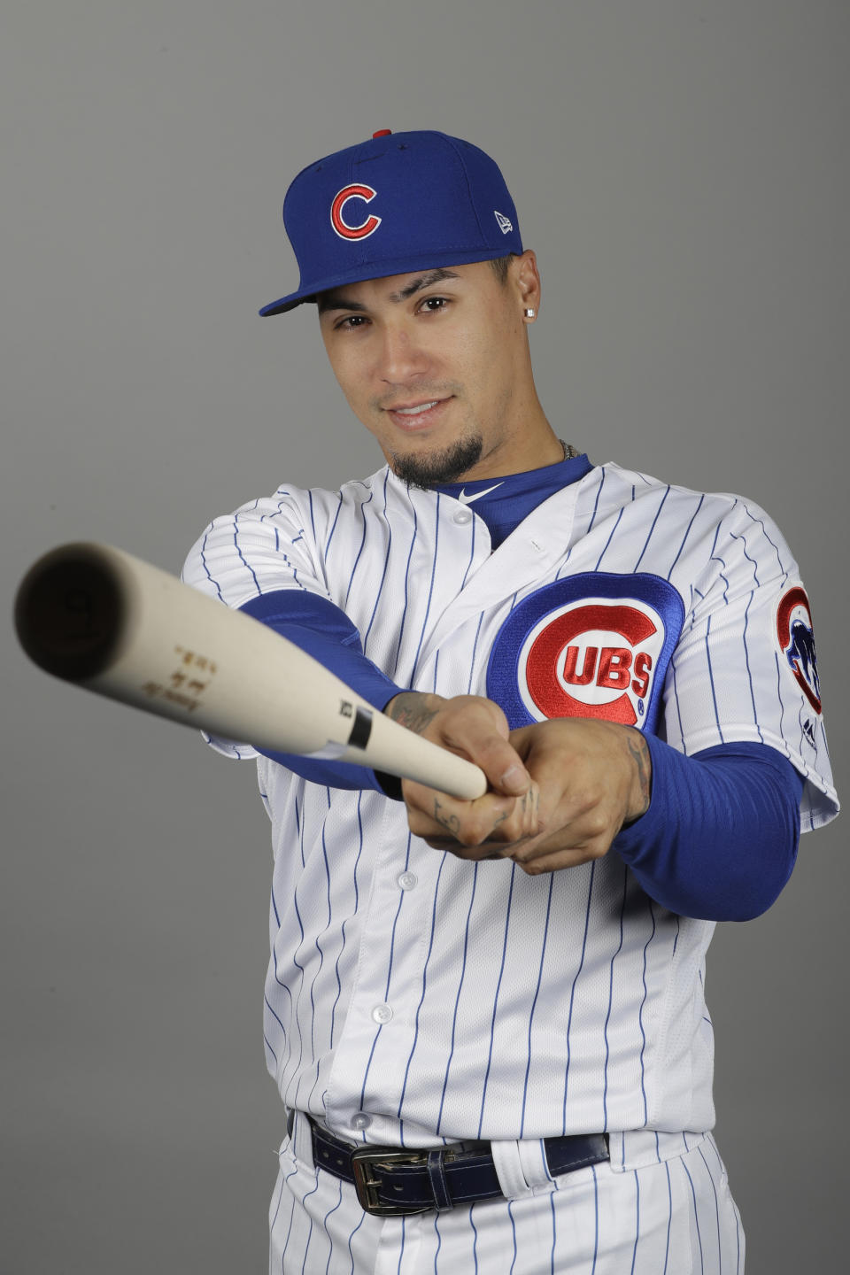 This is a 2019 photo showing Javier Baez of the Chicago Cubs baseball team. It does not take Javier Baez long to show off his magic tricks, even in a spring training game. The Chicago Cubs star singled in the first inning on Sunday, March 17, 2019, against the Colorado Rockies and stole second, escaping a tag by shortstop Garrett Hampson with a deft swim move. (AP Photo/Darron Cummings, File)