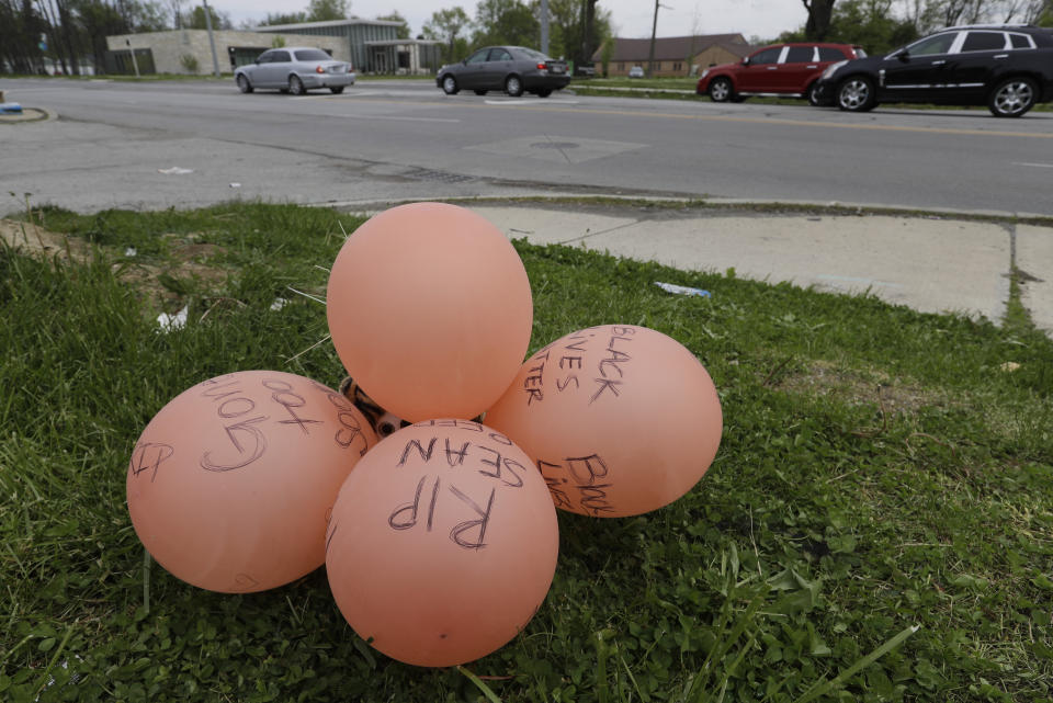 A display is seen, Friday, May 8, 2020, in Indianapolis. near the intersection of 62nd and Michigan Road in Indianapolis, Ind., where Dreasjon Reed was fatality shot by the Indianapolis Metropolitan Police Department. Indianapolis Police Chief Randal Taylor solemnly promised thoroughness and transparency as his department investigates the latest fatal shootings of black men in the city by officers. (AP Photo/Darron Cummings)