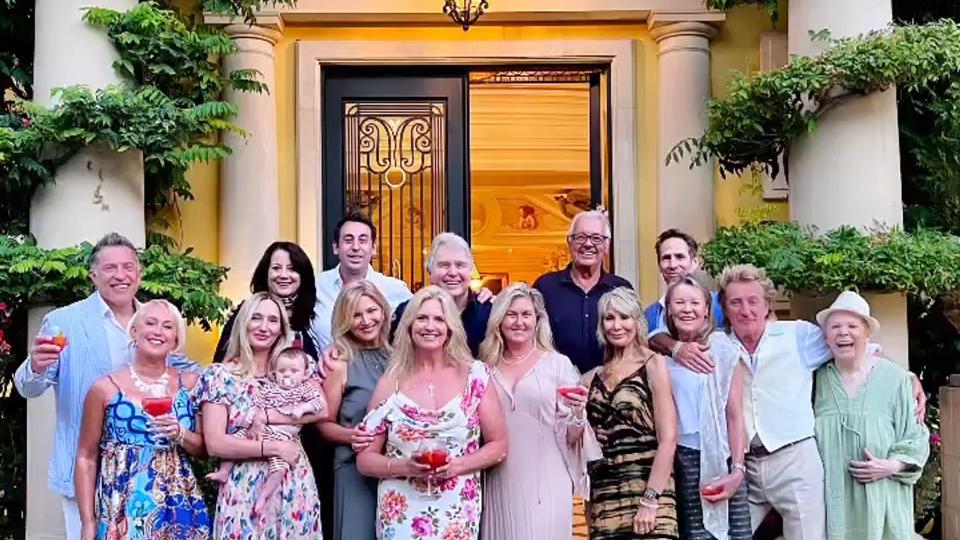 Penny Lancaster stood front and centre of the family photo alongside her husband Rod Stewart