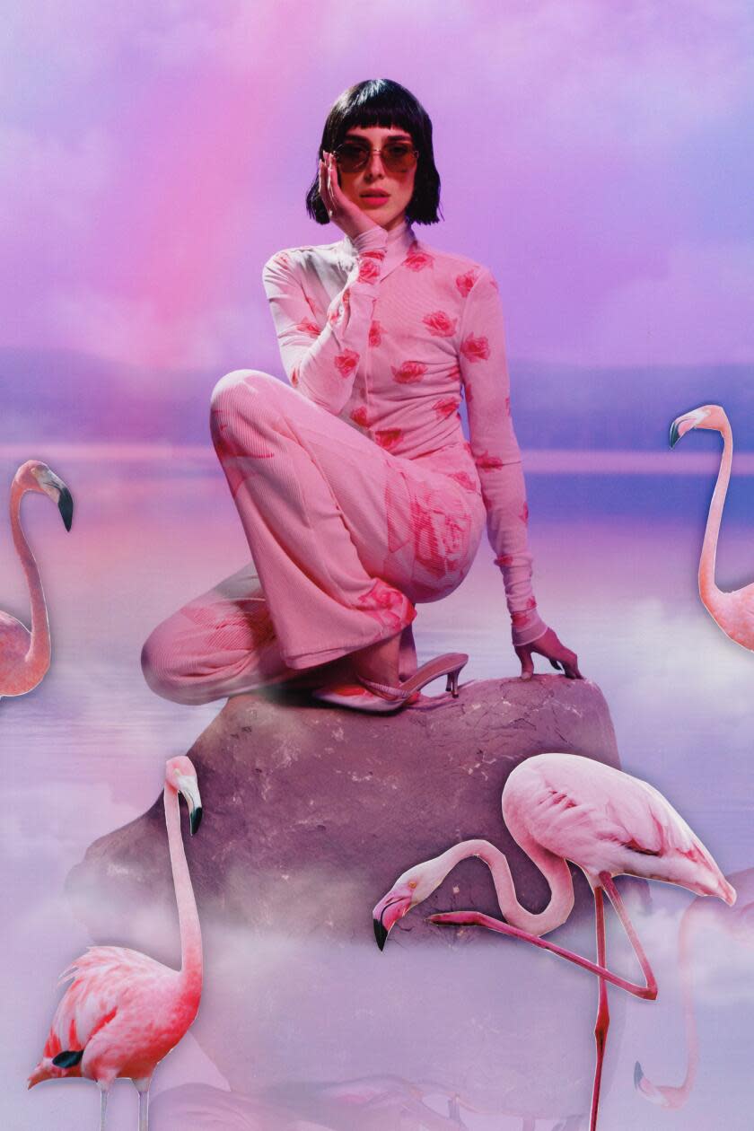 Nikola wears Cartier Signature Cs; Kenzo rose fitted shirt in faded pink mesh polyamide; rose turtleneck top in faded pink mesh polyamide; kitten heel in leather covered by faded pink Kenzo rose printed textile.