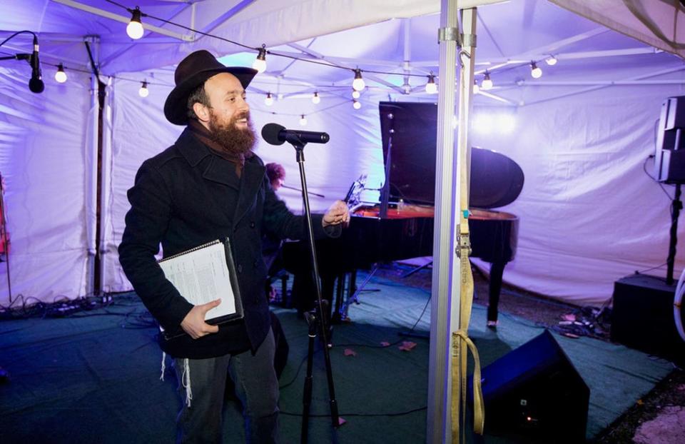 Rabbi Mendy Korer, co-chief executive at Chabad Islington, talking on stage at a previous Islington menorah lighting (Chabad Islington/PA) (PA Media)