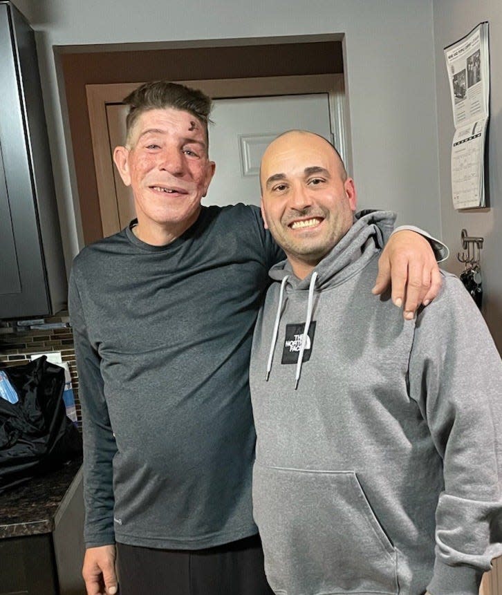 Matthew Keenan, left, with his friend, Evan Glover, right, who helped him attend appointments and invited Kennan over for a meal, laundry and shower.