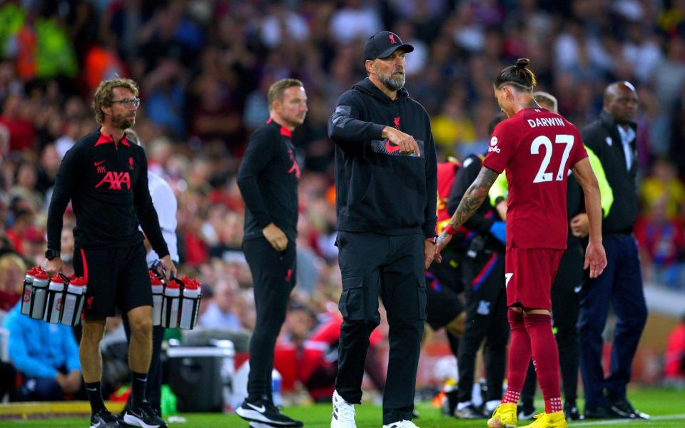 Liverpool's Darwin Nunez (right) walks past manager Jurgen Klopp as he leaves the pitch - PA