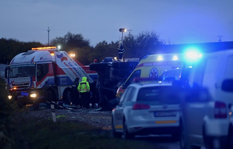 Rescue workers are seen at the site of a bus crash near the city of Nitra