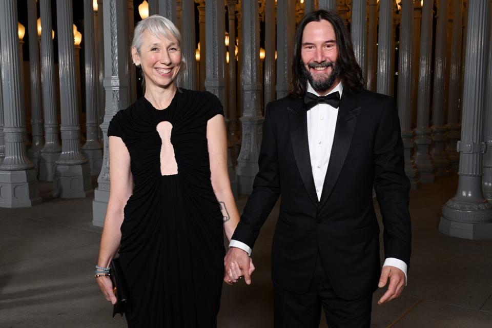 <p>Michael Kovac/Getty</p> Alexandra Grant and Keanu Reeves