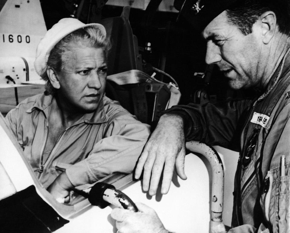 Pilot Jacqueline Cochran receives a pre-flight briefing from Chuck Yeager at Edward's Base, California on Aug 25, 1961. Cochran flew a Northrop-Talon T-38 Jet plane a 1,356 kms/h, breaking the record for the fastest female flight. Yeager was the first man to fly faster than the speed of sound.