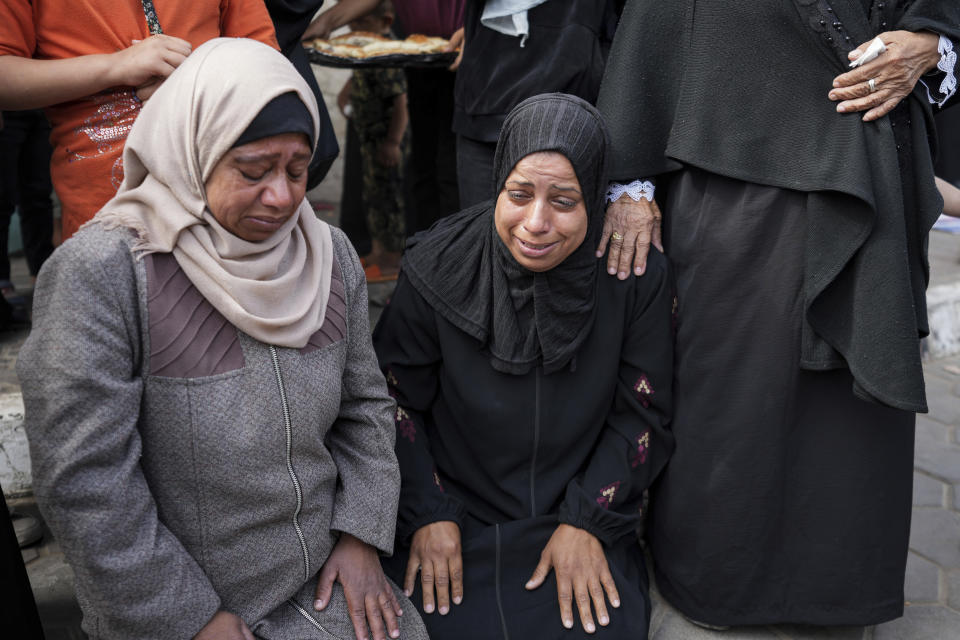 Mourners react next to the bodies of Palestinians who were killed in an Israeli airstrike in Gaza Stirp, at the Al Aqsa hospital in Deir al Balah, Gaza, Thursday, May 2, 2024. (AP Photo/Abdel Kareem Hana)