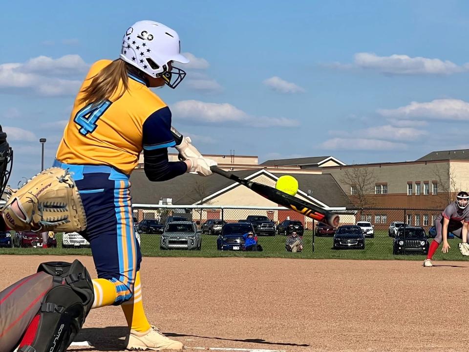 River Valley's Delaney Myers hits the ball in a home softball game against Shelby last year.