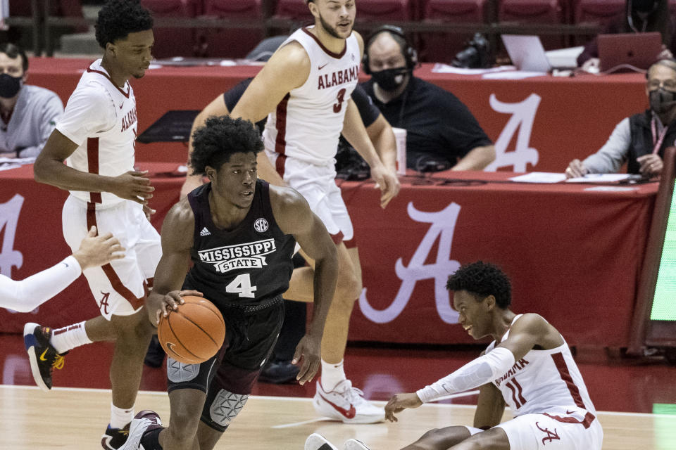 Mississippi State guard/forward Cameron Matthews (4) works the ball downcourt against Alabama during the first half of an NCAA college basketball game, Saturday, Jan. 23, 2021, in Tuscaloosa, Ala. (AP Photo/Vasha Hunt)