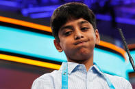 <p>Ishaan Akula of Morganville, N.J., reacts after spelling his word incorrectly during the 90th Scripps National Spelling Bee in Oxon Hill, Md., Wednesday, May 31, 2017. (AP Photo/Jacquelyn Martin) </p>