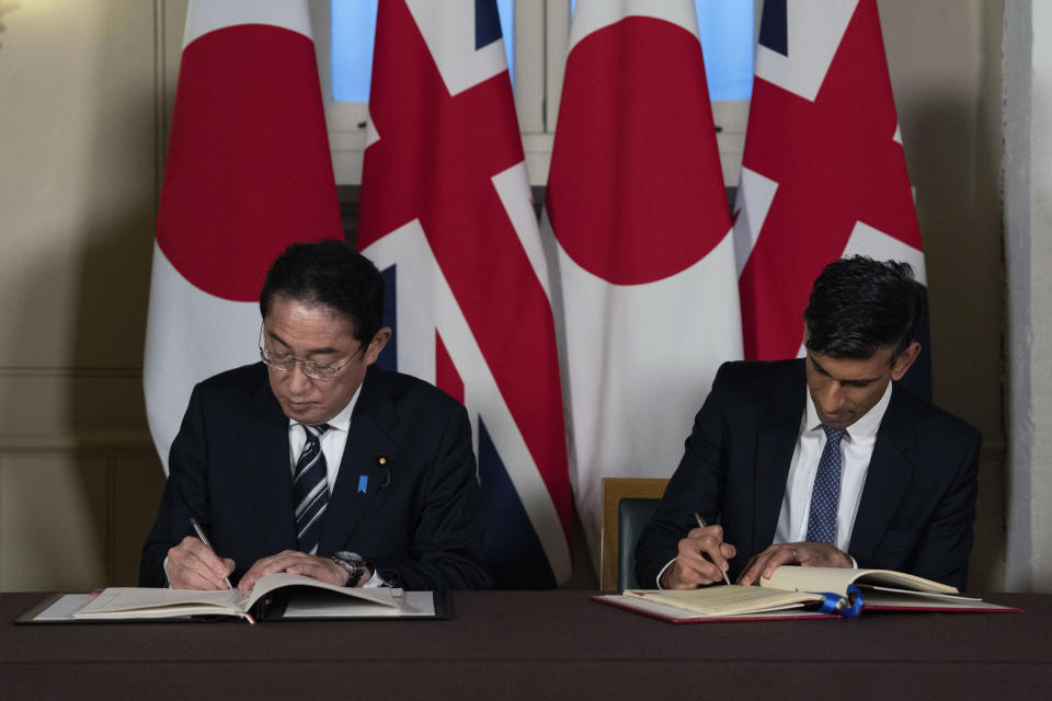 Britain's Prime Minister Rishi Sunak, right, and Japan's Prime Minister Fumio Kishida sign a defence agreement during a bilateral meeting at the Tower of London, Wednesday, Jan. 11, 2023. The leaders of Britain and Japan are signing a defense agreement on Wednesday that could see troops deployed to each others’ countries. (Carl Court/Pool Photo via AP, File)
