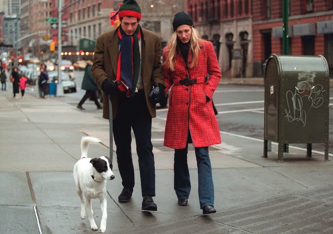 John F. Kennedy Jr. and his wife Carolyn walk with their dog January 1, 1997 in New York City. 