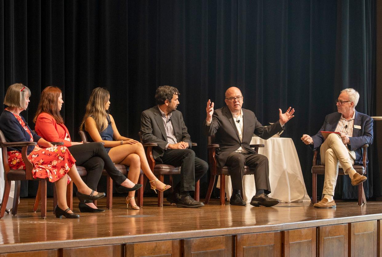 Congressman James P. McGovern, second from right, leads a discussion on hunger at College of the Holy Cross Monday.