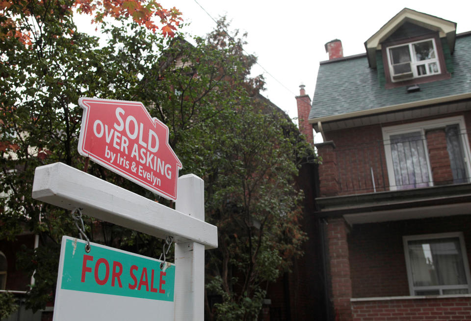 A “Sold over asking” sign is on display on a house for sale in Toronto’s housing market Oct. 21, 2016. (HuffPost CA)