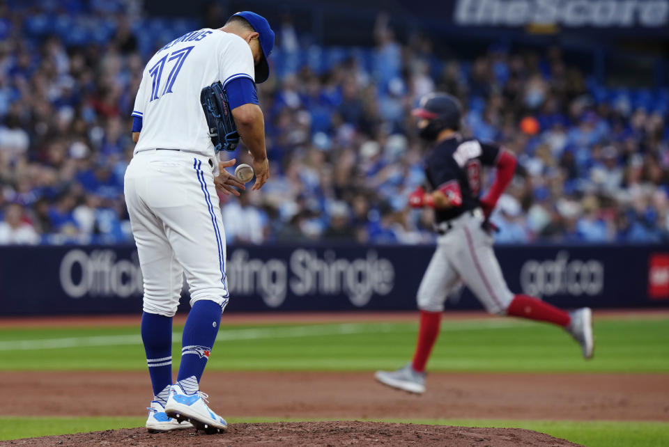 Toronto Blue Jays starting pitcher Jose Berrios waits as Washington Nationals' Carter Kieboom runs the bases on a two-run home run during the second inning of a baseball game Tuesday, Aug. 29, 2023, in Toronto. (Frank Gunn/The Canadian Press via AP)