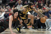 Toronto Raptors guard Gary Trent Jr., right, steals the ball from Washington Wizards forward Deni Avdija (8) during the first half of an NBA basketball game in Toronto Sunday, April 7, 2024. (Frank Gunn/The Canadian Press via AP)