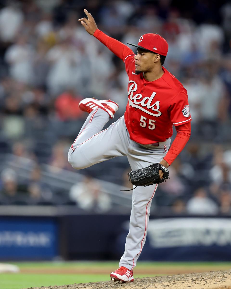 Jul 14, 2022; Bronx, New York, USA; Cincinnati Reds relief pitcher Dauri Moreta (55) follows through on a pitch against the New York Yankees during the tenth inning at Yankee Stadium. Mandatory Credit: Brad Penner-USA TODAY Sports
