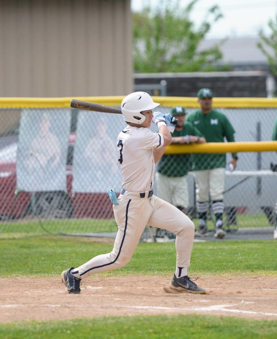 Central Catholic’s Trace Hernandez hits a single during a Valley Oak League matchup with Manteca at Manteca High School on Friday, April 26, 2024.