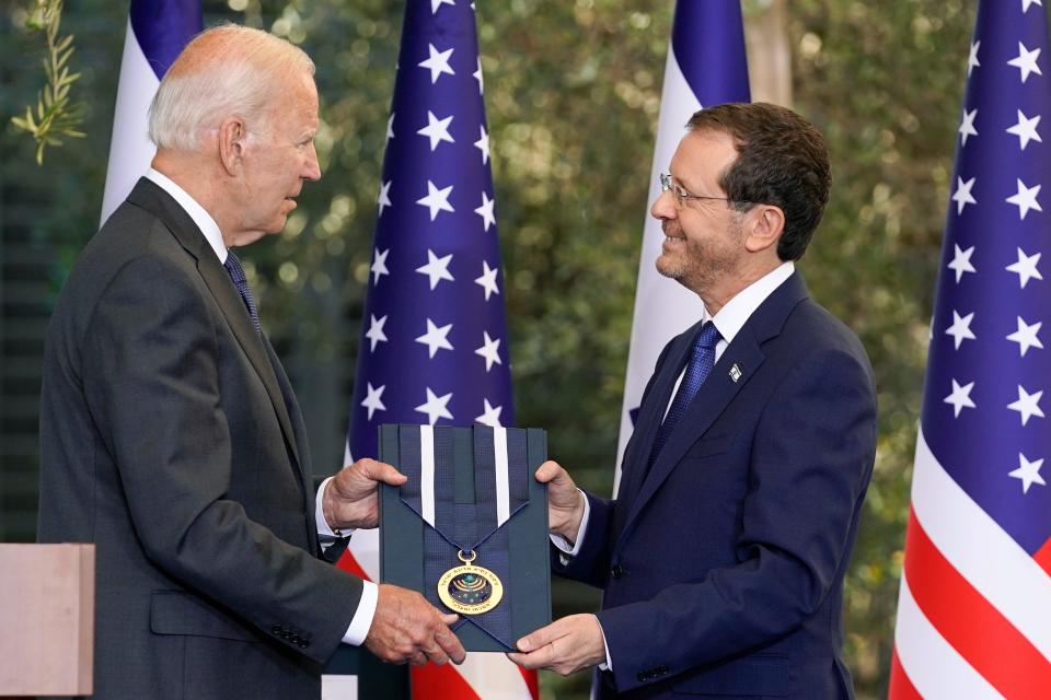 President Joe Biden receives the Israeli Presidential Medal of Honor from Israeli President Isaac Herzog, Thursday, July 14, 2022, in Jerusalem. (AP Photo/Evan Vucci) ORG XMIT: ILEV454