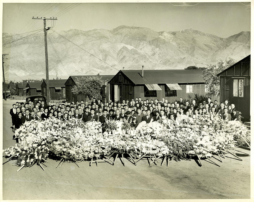 CORRECTS SOURCE TO TOYO MIYATAKE STUDIO - This 1945 photo provided by the Toyo Miyatake Studio shows a memorial service for Giichi Matsumura, who died on nearby Mount Williamson during his incarceration at an internment camp for people of Japanese ancestry in Manzanar, Calif., during World War II. A skeleton found by hikers this fall near California's second-highest peak was identified Friday, Jan. 3, 2020, as Matsumura, a Japanese American artist who had left the Manzanar internment camp to paint in the mountains in the waning days of World War II. (Toyo Miyatake Studio via AP)