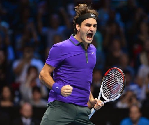 Roger Federer celebrates after beating Andy Murray in their semi-final match on the seventh day of the ATP World Tour Finals on November 11. Federer raised the biggest cheers from the audience as he cruised to a 7-6 (7/5), 6-2 win