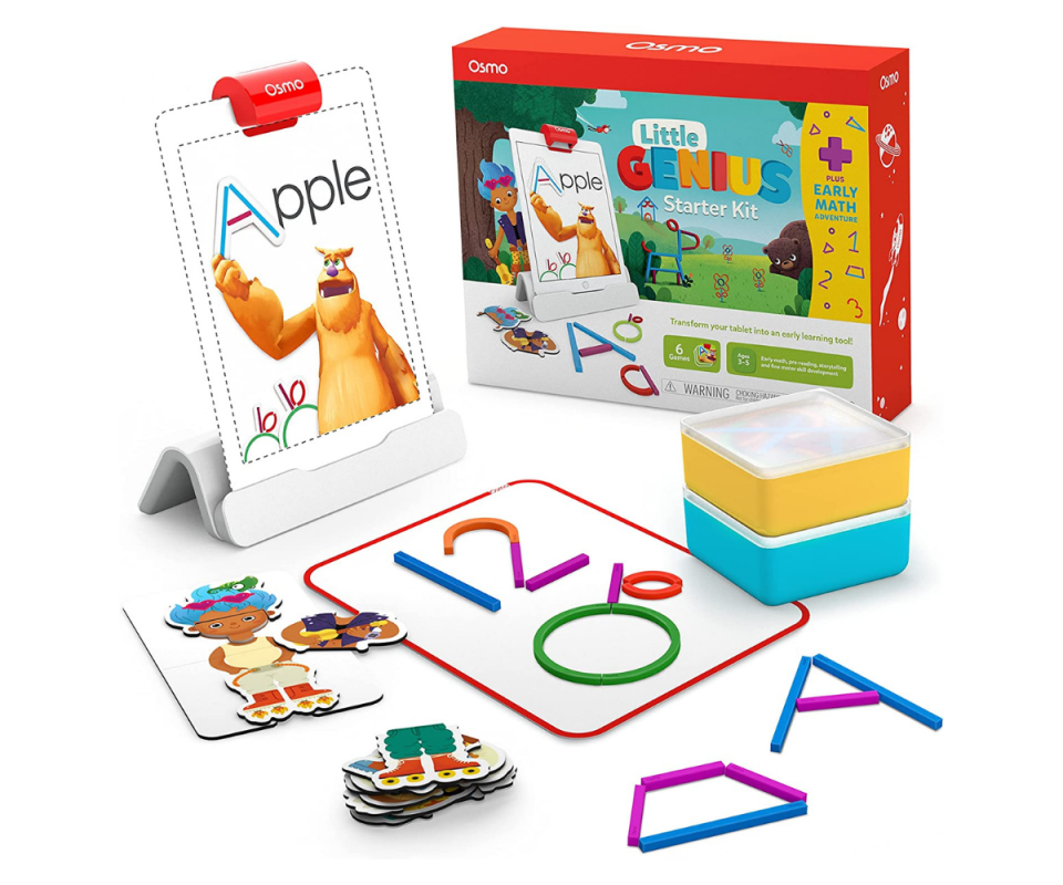 A kids board game of shapes and magnet pieces on a white background with the pieces laid out in front in bright colours. 