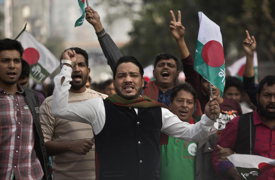 Supporters of Bangladesh Awami League shout slogans during an election rally ahead of the general elections in Dhaka, Bangladesh, Thursday, Dec. 27, 2018. Bangladesh heads for the 11th National Parliamentary Election on Dec. 30, amid opposition allegations that thousands of its leaders and activists have been arrested to weaken them. But authorities say the arrests are not politically motivated and the opposition is trying to create chaos ahead of elections. (AP Photo/Anupam Nath)