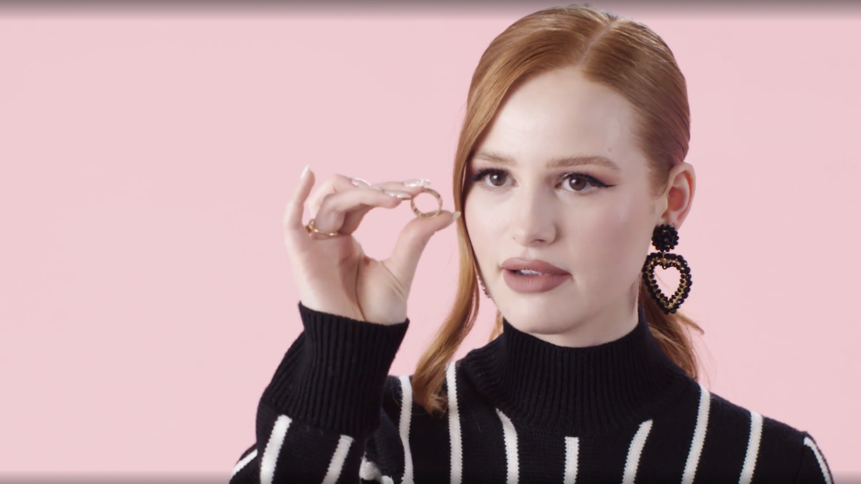 madelaine holding the ring up