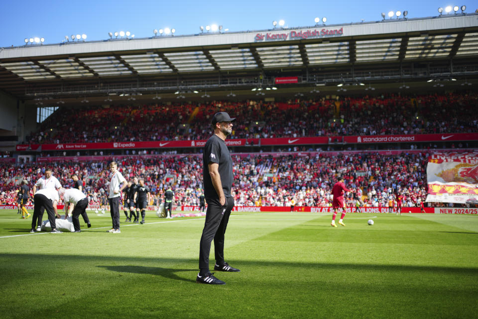 Liverpool's manager Jurgen Klopp waits for the start of the English Premier League soccer match between Liverpool and Wolverhampton at Anfield Stadium in Liverpool, England, Sunday, May 19, 2024. (AP Photo/Jon Super)