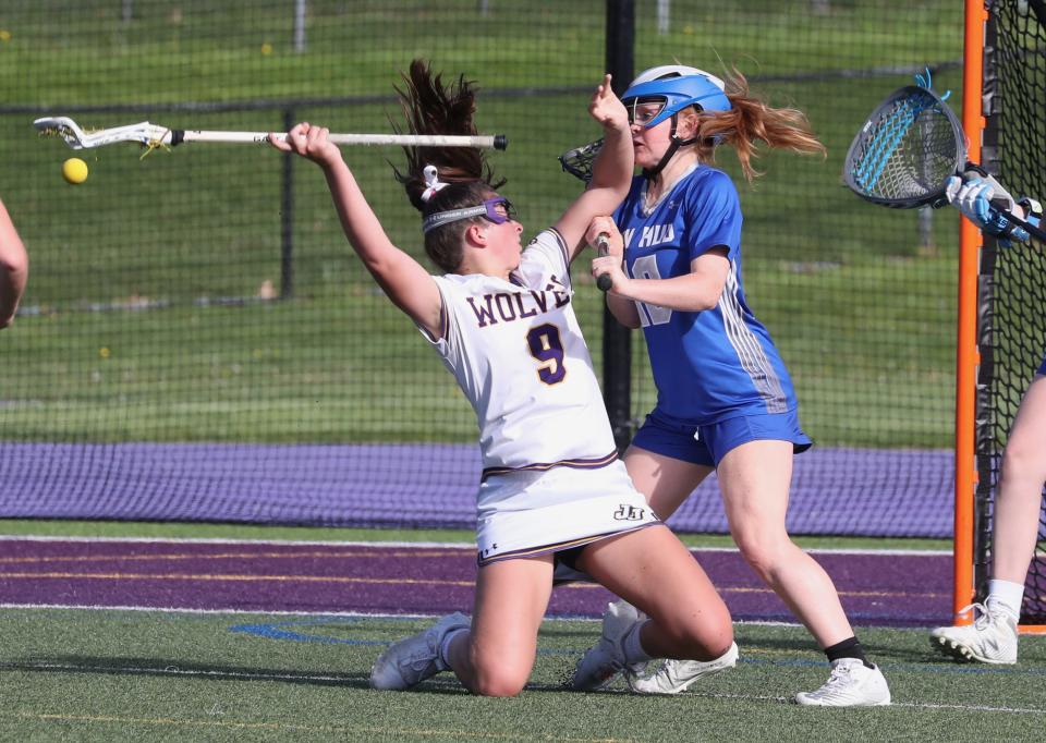 John Jay-Cross River's Kate Mercer is pressured by Hen Hud's Katherine Couch during their game at John Jay May 10, 2022. John Jay won 15-9.