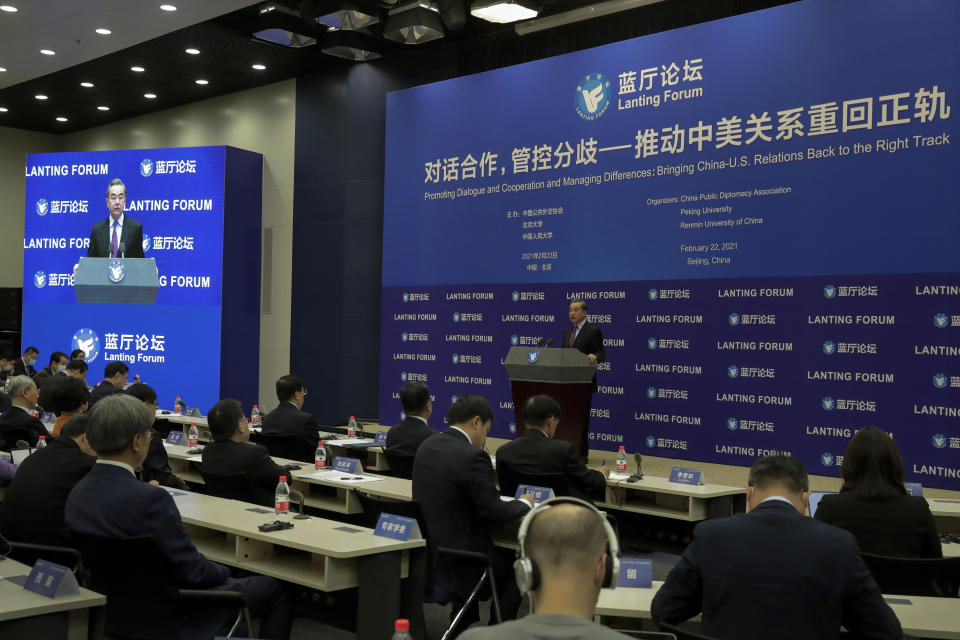 Chinese Foreign Minister Wang Yi delivers his opening remarks at the Lanting Forum on bringing China-U.S. relations back to the right track, at the Ministry of Foreign Affairs office in Beijing on Monday, Feb. 22, 2021. Wang called on the U.S. Monday to lift restrictions on trade and people-to-people contacts while ceasing what Beijing considers unwarranted interference in the areas of Taiwan, Hong Kong, Xinjiang and Tibet. (AP Photo/Andy Wong)