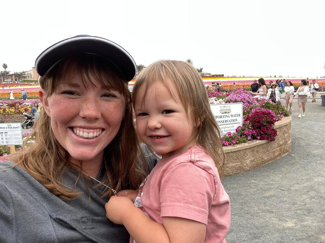 Mom and daughter posing for a photo