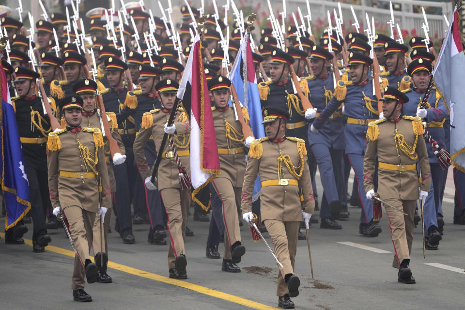 Egyptian Army soldiers march through the ceremonial Kartavya Path boulevard during India's Republic Day celebrations in New Delhi, India, Thursday, Jan. 26, 2023. Egyptian President Abdel Fattah El-Sissi looked on as an official guest of India’s Republic Day event, which marked the anniversary of the adoption of the country’s constitution on Jan. 26, 1950, nearly three years after it won independence from British colonial rule. (AP Photo/Manish Swarup)