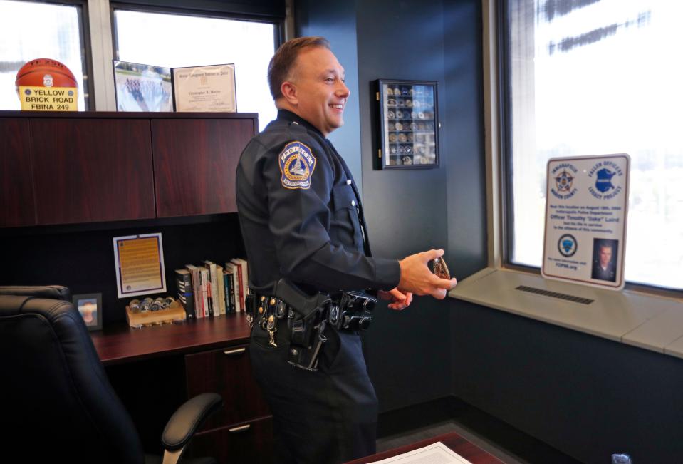 IMPD Assistant Chief Chris Bailey shows items in his office Wednesday, Oct. 27, 2021 in the City-County Building.