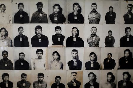 Photos of victims displayed at the Tuol Sleng Genocide Museum in Phnom Penh. REUTERS/Damir Sagolj