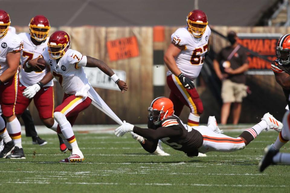 CLEVELAND, OHIO - SEPTEMBER 27: Dwayne Haskins #7 of the Washington Football Team is tackled from behind by Myles Garrett #95 of the Cleveland Browns at FirstEnergy Stadium on September 27, 2020 in Cleveland, Ohio. Cleveland won the game 34-20. (Photo by Gregory Shamus/Getty Images)