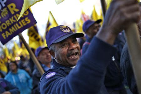 Members of the Service Employees International Union (SEIU) march during a protest in support of a new contract for apartment building workers in New York City, April 2, 2014. REUTERS/Mike Segar