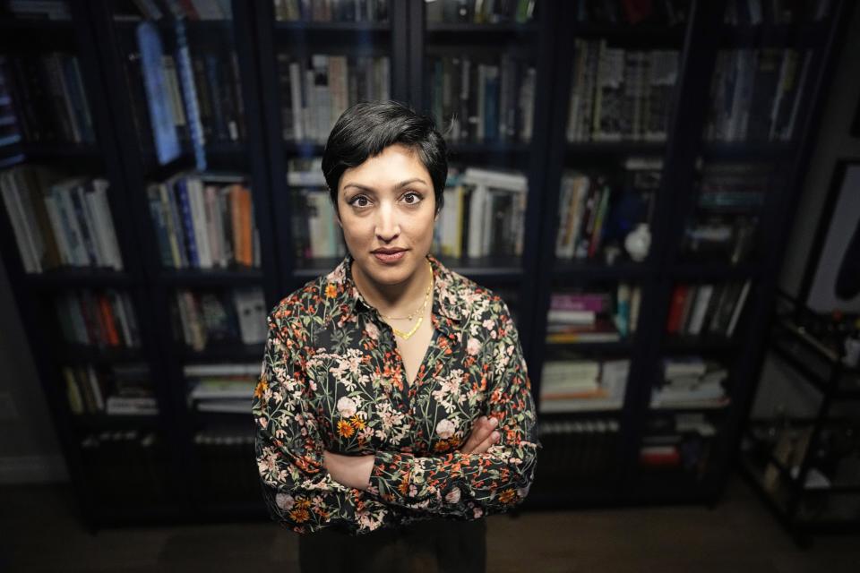 Rumman Chowdhury, co-founder of Humane Intelligence, a nonprofit developing accountable AI systems, poses for a photograph at her home Monday, May 8, 2023, in Katy, Texas. ChatGPT maker OpenAI, and other major AI providers such as Google and Microsoft, are coordinating with the Biden administration to let thousands of hackers take a shot at testing the limits of their technology. Chowdhury is the lead coordinator of the mass hacking event planned for this summer's DEF CON hacker convention in Las Vegas. (AP Photo/David J. Phillip)