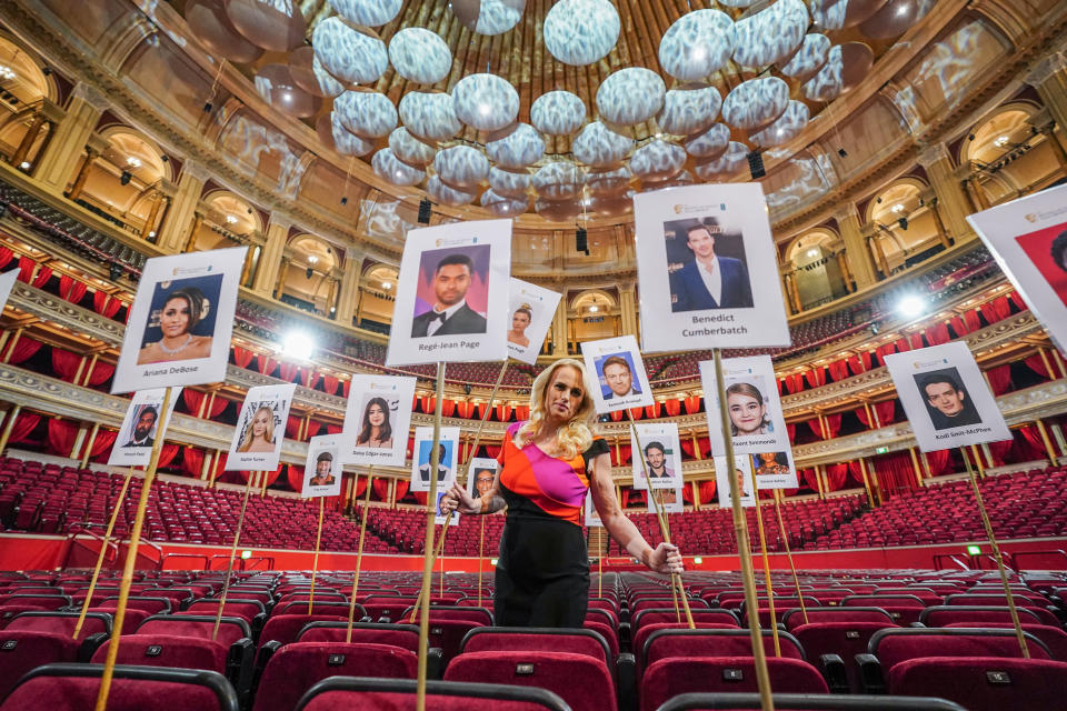 Rebel Wilson with the 'Heads on sticks' that are used to check for camera blocking for the forthcoming EE British Academy Film Awards, ahead of Sunday's awards show, at the Royal Albert Hall, London. Picture date: Tuesday March 8, 2022.