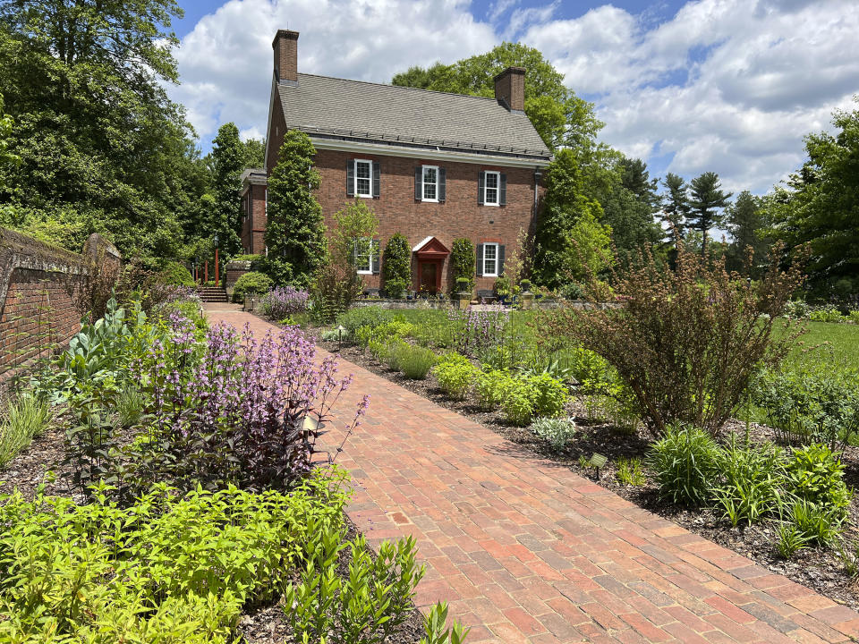 This undated photo provided by Mt. Cuba Center shows the Hockessin, Del. botanical garden's formal South Garden, planted entirely with native plants and cultivars of native plants, including: Penstemon, Thalictrum, Tradescantia, Liatris, Monarda, Amsonia, Artemesia, Baptisia, Eryngium, Physocarpus, Redbeckia, Solidago and Eryngium species. (Melissa Starkey/Mt. Cuba Center via AP)