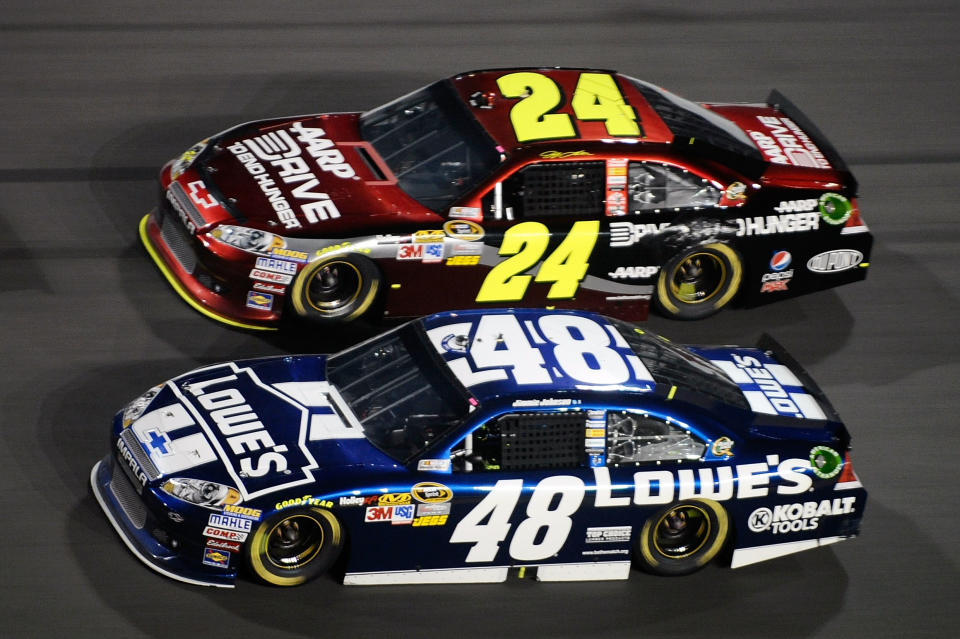 DAYTONA BEACH, FL - FEBRUARY 18: Jimmie Johnson, driver of the #48 Lowe's Chevrolet, and Jeff Gordon, driver of the #24 Drive to End Hunger Chevrolet, race side by side during the NASCAR Budweiser Shootout at Daytona International Speedway on February 18, 2012 in Daytona Beach, Florida. (Photo by Jared C. Tilton/Getty Images for NASCAR)