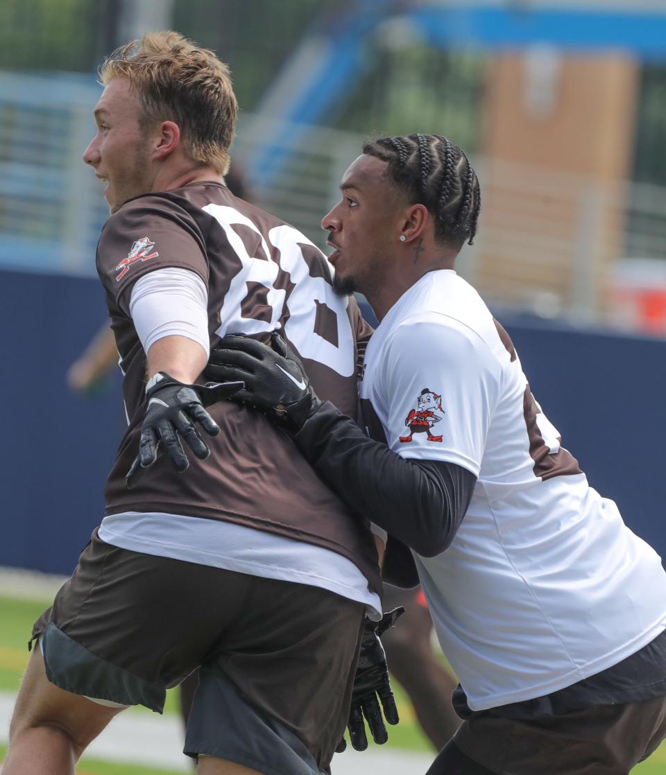 Cleveland Browns tight end Harrison Bryant, left is covered by Grant Delpit during minicamp on Wednesday, June 15, 2022 in Canton, Ohio, at Tom Benson Hall of Fame Stadium.