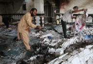 <p>Relatives inspect after an overnight suicide attack at a mosque in Herat, Afghanistan, Aug. 2, 2017. (Photo: Mohammad Shoib/Reuters) </p>