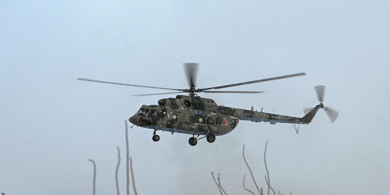 A Russian Mi-8 military helicopter is seen during flight testing conducted by the Russian Air Force of the Southern Military District during snowfall at a military aerodrome in the Rostov region, Russia January 19, 2022. REUTERS/Sergey Pivovarov