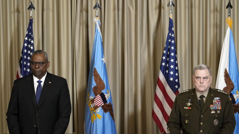 U.S. Defense Secretary Lloyd Austin and Chairman of the Joint Chiefs of Staff Mark Milley, from left, watching the media after the meeting of the 'Ukraine Defense Contact Group' at Ramstein Air Base in Ramstein, Germany, Friday, April 21, 2023. The U.S. will begin training Ukrainian forces how to use and maintain Abrams tanks in the coming weeks, as the U.S. continues to speed up its effort to get them onto the battlefield as quickly as possible, U.S. officials said Friday. (AP Photo/Matthias Schrader)