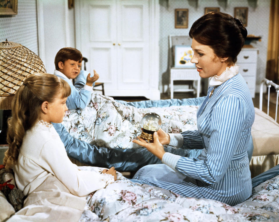 Mary Poppins holding the snow globe that was saved from the bin. (Alamy)