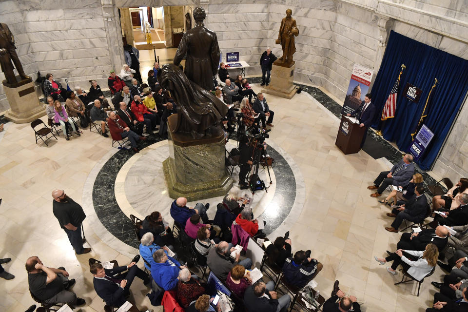 Members of the Faith and Family advocacy group, a pro life organization, hold a rally in the rotunda of the Kentucky State Capitol in Frankfort, Ky., Thursday, Feb. 16, 2023. The Kentucky Supreme Court on Thursday refused to allow abortions to resume in the state, rejecting a request to halt a near total ban of the procedure. (AP Photo/Timothy D. Easley)